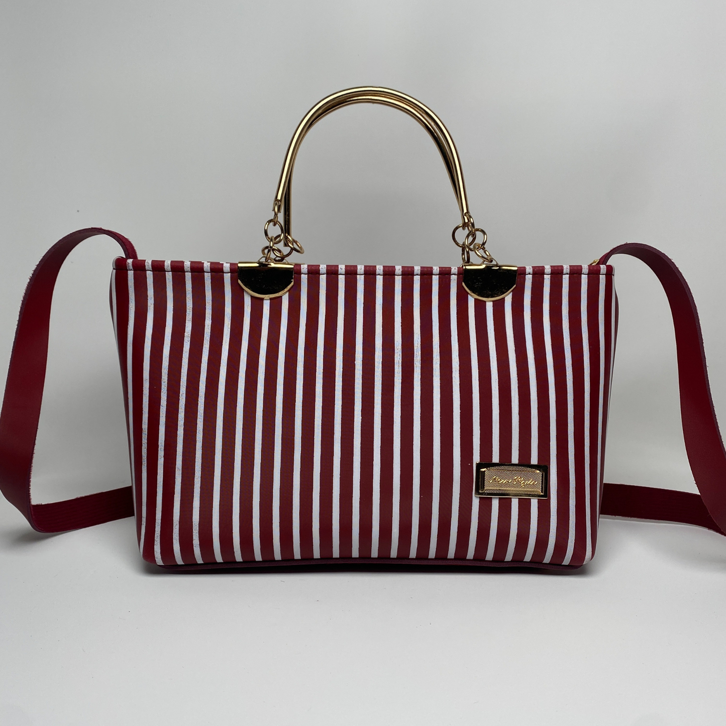 Elegant Striped Handbag with Gold Handles & Shoulder Strap